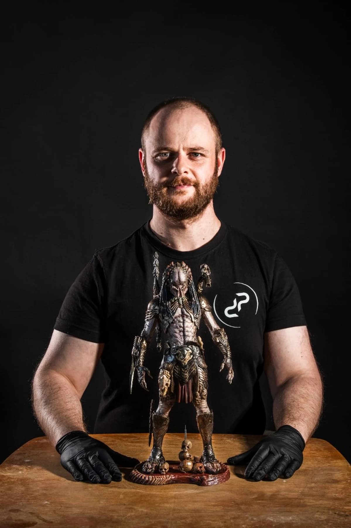 Predator statue beside Pavel for scale